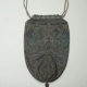 Knitted, beaded, drawstring handbag with rampant peacock design.