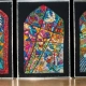 Kirk Dunn standing in front of three multicolored knit panels depicting elements of the Jewish, Christian, and Islamic faiths