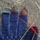 Rainbow Fingertips for Sanquhar Gloves on Antique Brass Table.