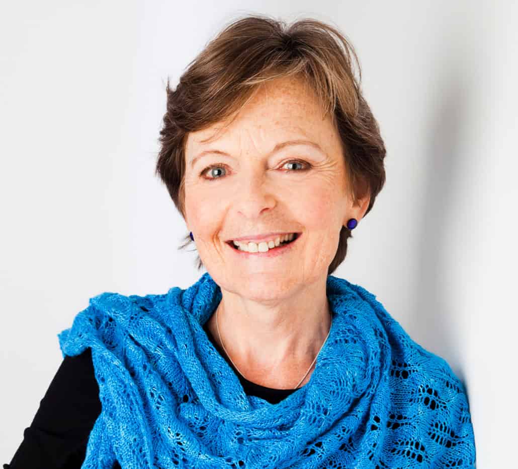 Betsan Corkhill wearing a blue knit shawl