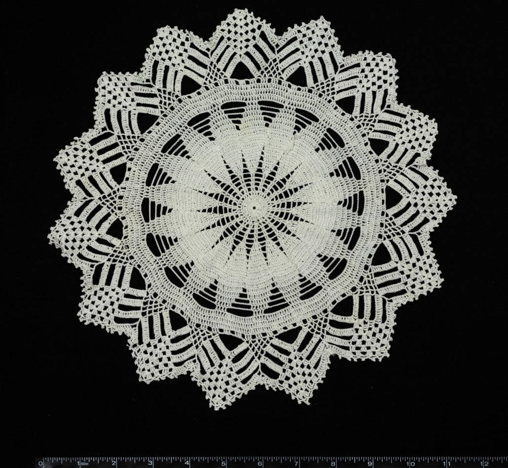 A starburst of thread, worked in crochet stitches.