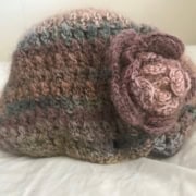 Knit cap with a knit rose accent