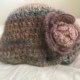 Knit cap with a knit rose accent
