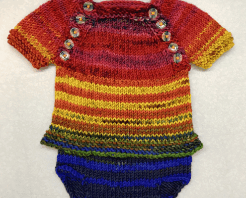 A suit of rainbow baby clothes